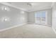 Bedroom featuring large windows and French doors leading to a private balcony at 3447 Flamingo Blvd, Hernando Beach, FL 34607