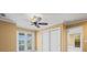 Comfortable bedroom features closet, balcony access, and view of pool at 3447 Flamingo Blvd, Hernando Beach, FL 34607
