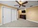 Bedroom featuring a wet bar, TV, ceiling fan, and a closet with white doors at 3447 Flamingo Blvd, Hernando Beach, FL 34607