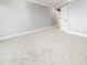 Bedroom featuring neutral walls, white trim, and plush carpet at 3447 Flamingo Blvd, Hernando Beach, FL 34607