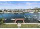 Waterfront home featuring a private wooden dock along a peaceful waterway at 3447 Flamingo Blvd, Hernando Beach, FL 34607