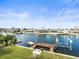 Waterfront home featuring a private wooden dock along a peaceful waterway at 3447 Flamingo Blvd, Hernando Beach, FL 34607
