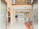 Grand foyer with high ceilings, decorative columns, and elegant staircase at 3447 Flamingo Blvd, Hernando Beach, FL 34607