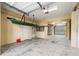Spacious garage featuring high ceilings and ample storage space for vehicles and equipment at 3447 Flamingo Blvd, Hernando Beach, FL 34607