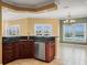 Second view of kitchen with dark granite counters and a breakfast bar and seating area at 3447 Flamingo Blvd, Hernando Beach, FL 34607
