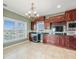 Gourmet kitchen with custom cabinets, granite countertops, wine fridge and a beautiful waterfront view at 3447 Flamingo Blvd, Hernando Beach, FL 34607