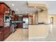 Kitchen with stainless steel appliances, custom cabinets, a granite countertop, and an island at 3447 Flamingo Blvd, Hernando Beach, FL 34607