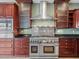 Close up of kitchen with stainless appliances and dark cabinetry at 3447 Flamingo Blvd, Hernando Beach, FL 34607