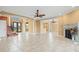 Open living area boasts tile floors, fireplace and great flow to foyer at 3447 Flamingo Blvd, Hernando Beach, FL 34607