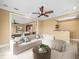 Comfortable living room with a large sofa, and neutral decor and open access to an additional living space at 3447 Flamingo Blvd, Hernando Beach, FL 34607