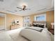 Staged main bedroom with carpet, a ceiling fan, and access to a private balcony at 3447 Flamingo Blvd, Hernando Beach, FL 34607