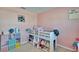 Delightful pink bedroom featuring a cozy bunk bed and ample storage, offering a fun and functional space for a  at 36707 Goffaux Loop, Zephyrhills, FL 33541