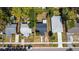 Aerial view of a single Gathering home with a dark roof and mature trees at 3765 21St S Ave, St Petersburg, FL 33711
