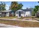 Charming bungalow featuring tidy landscaping, a walkway and a newly painted exterior at 3765 21St S Ave, St Petersburg, FL 33711