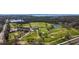 Scenic aerial shot of a lush green golf course near a bay with boats and a building at 3765 21St S Ave, St Petersburg, FL 33711