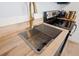 Kitchen sink and countertop with gold faucet and stainless steel fixtures at 3765 21St S Ave, St Petersburg, FL 33711