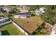 An aerial shot showing the home's large backyard space, surrounded by a pristine white fence, offering privacy at 3908 Wahoo Se Dr, St Petersburg, FL 33705