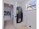 Utility room with water heater and view of a nicely decorated room through an open doorway at 3908 Wahoo Se Dr, St Petersburg, FL 33705