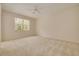 Spacious bedroom featuring neutral tones, carpeted flooring and a bright window at 4216 Preserve Pl, Palm Harbor, FL 34685