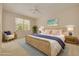 Bright bedroom with a comfortable bed, soft lighting, and a serene, coastal-inspired decor at 4216 Preserve Pl, Palm Harbor, FL 34685