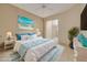 Stylishly staged bedroom with a beachy theme and access to an outdoor space at 4216 Preserve Pl, Palm Harbor, FL 34685