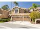 Two-story townhome showcasing a two-car garage, manicured shrubs, and a well-maintained facade at 4216 Preserve Pl, Palm Harbor, FL 34685