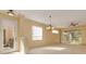 Bright living room with natural light, neutral color palette, tile floors and a ceiling fan at 4216 Preserve Pl, Palm Harbor, FL 34685