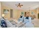 Comfortable living room with stylish decor, neutral colors, and open floor plan at 4216 Preserve Pl, Palm Harbor, FL 34685