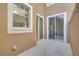 Outdoor patio area with both sliding door and window access to the home at 4216 Preserve Pl, Palm Harbor, FL 34685