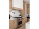 Gourmet kitchen boasts a Wolf range, custom cabinets and marble backsplash at 440 Capri Ne Way, St Petersburg, FL 33704