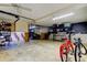 Spacious basement with concrete floors, bicycle, and shelves for storage at 510 Pine S Ave, Oldsmar, FL 34677