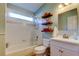Bathroom features a tub and shower combination, a toilet, and single vanity at 510 Pine S Ave, Oldsmar, FL 34677