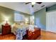 Comfortable bedroom features ceiling fan, a full bed, and two bedside lamps at 510 Pine S Ave, Oldsmar, FL 34677
