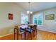 Elegant dining room featuring hardwood floors and natural light perfect for entertaining guests at 510 Pine S Ave, Oldsmar, FL 34677