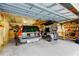 Spacious garage features storage shelves, utility vehicle, and an automobile at 510 Pine S Ave, Oldsmar, FL 34677