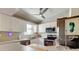 Modern kitchen features stainless steel appliances, white cabinets, and ample counter space at 510 Pine S Ave, Oldsmar, FL 34677