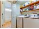 Laundry Room featuring washer, dryer and shelving at 510 Pine S Ave, Oldsmar, FL 34677
