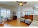 Cozy living room boasts hardwood floors and seating, bathed in natural light at 510 Pine S Ave, Oldsmar, FL 34677