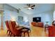 Cozy living room featuring laminate floors, vaulted ceiling and plenty of room to relax at 510 Pine S Ave, Oldsmar, FL 34677
