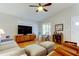 Inviting living room featuring a ceiling fan and plenty of natural light at 510 Pine S Ave, Oldsmar, FL 34677
