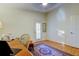 Bright office features hardwood floors, an area rug, and a ceiling fan at 510 Pine S Ave, Oldsmar, FL 34677