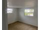 Bedroom with carpet flooring, neutral paint, and plenty of natural light at 5253 Falcon Dr, Holiday, FL 34690