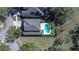 Aerial view showcasing the home, pool, manicured landscaping, and surrounding neighborhood at 5411 Starling Ridge Dr, Lithia, FL 33547