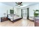 Calming main bedroom featuring a ceiling fan, bedside tables, and natural light at 5411 Starling Ridge Dr, Lithia, FL 33547