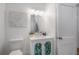 Bright bathroom featuring a stylish vanity with leafy decor, modern fixtures, and coordinated accents at 5603 N Taliaferro Ave, Tampa, FL 33604