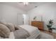 Bright bedroom with wood floors, modern decor and neutral tones creates a calming, inviting space at 5603 N Taliaferro Ave, Tampa, FL 33604