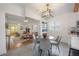 Bright dining area featuring a round table, elegant chairs, and view to living area at 5603 N Taliaferro Ave, Tampa, FL 33604