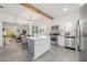 The bright kitchen has a center island and stainless steel appliances at 5603 N Taliaferro Ave, Tampa, FL 33604