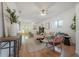 Stylish living room featuring hardwood floors, neutral tones, and ample space for modern living at 5603 N Taliaferro Ave, Tampa, FL 33604