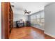 Sitting room with hardwood floors, custom wood bookcase and plantation shutters at 6208 Anhinga Pl, Tampa, FL 33615